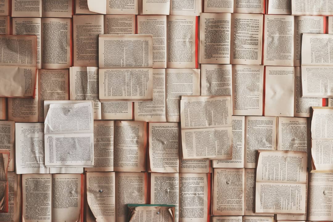 First-Person Cultural Historian POV: Vintage Paperback Open on Wooden Table